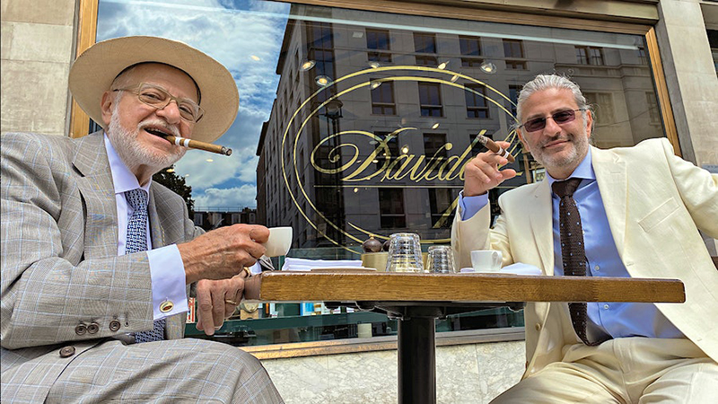 Edward and Eddie Sahakian smoking cigars with coffee outside Davidoff shop