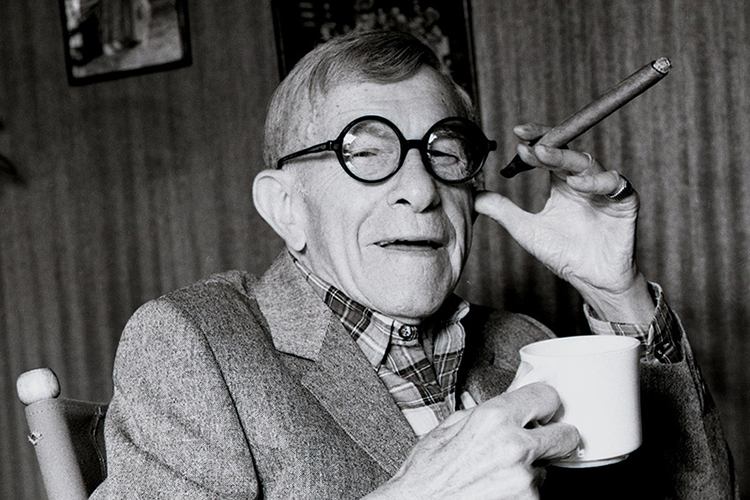 George Burns with a cigar and coffee