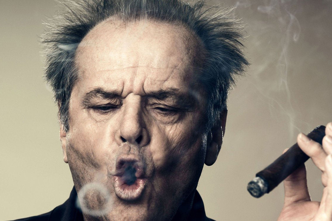 Jack Nicholson skillfully crafting smoke rings with his cigar