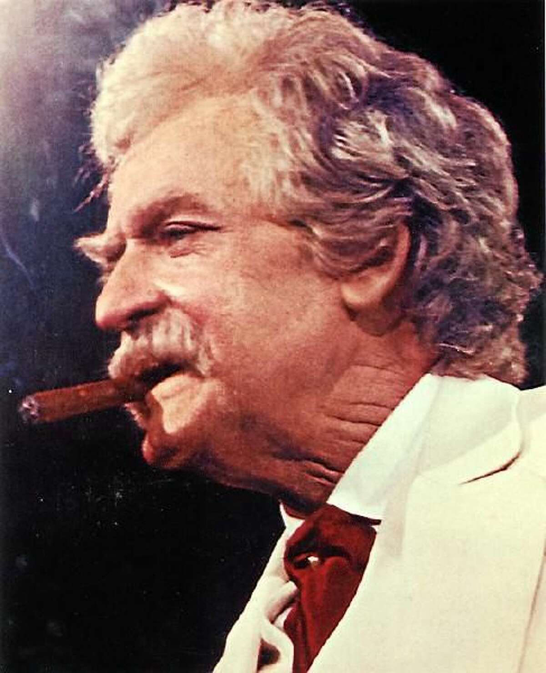 Mark Twain smoking a cigar