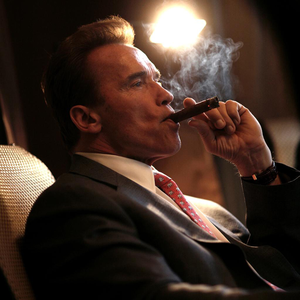 Arnold Schwarzenegger smoking a cigar
