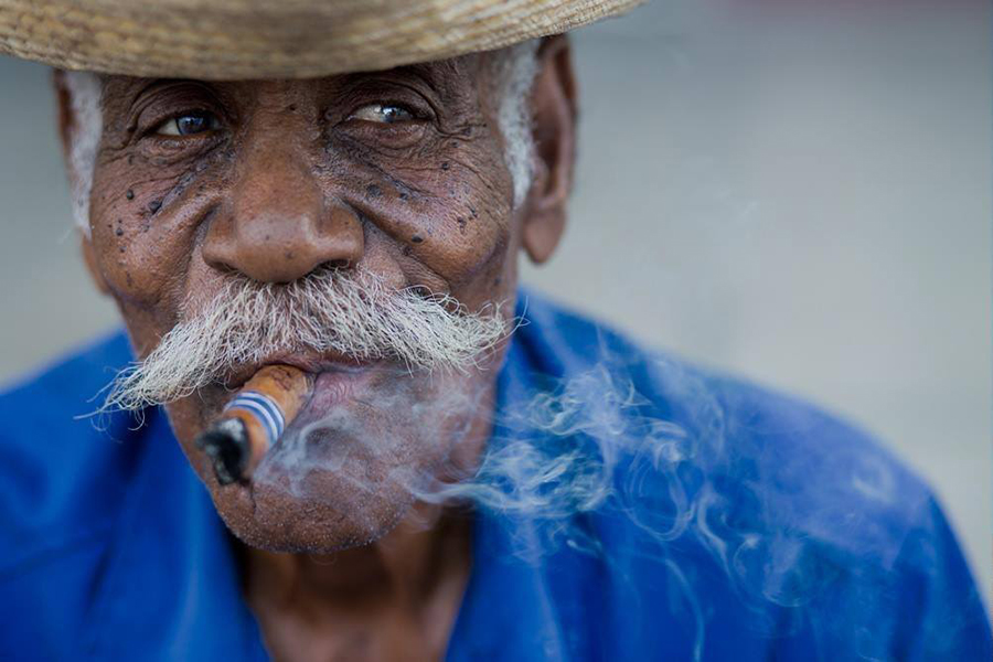 Cuban smoking a cigar
