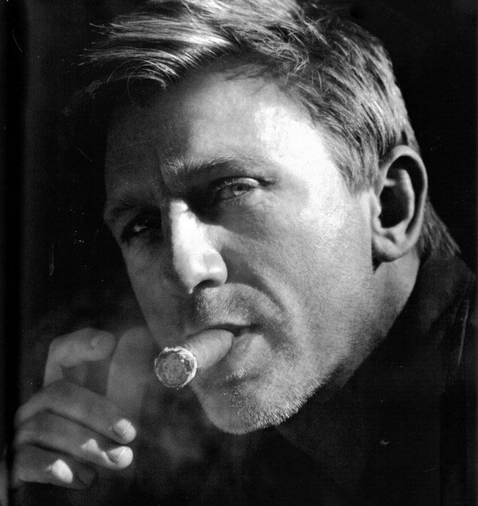 Daniel Craig smoking a cigar