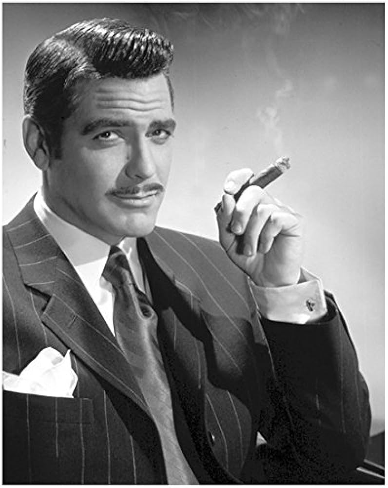 George Clooney smoking a cigar