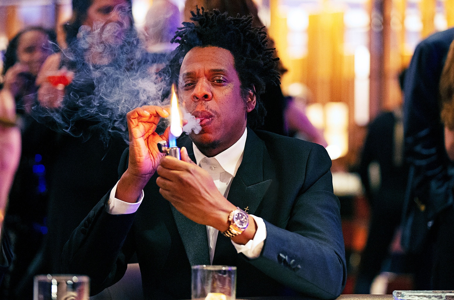 Jay Z lighting a cigar