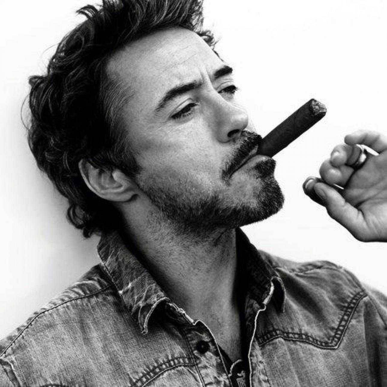 Robert Downey Jr smoking a cigar
